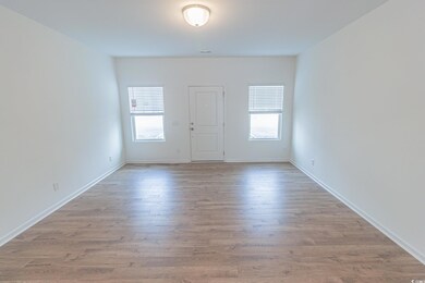 Spare room with light wood finished floors and baseboards