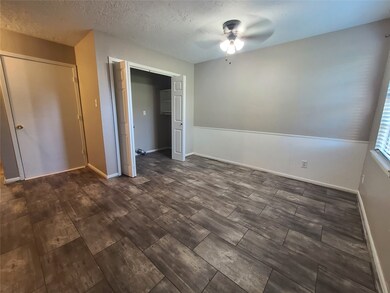 DINING AREA W/ UTILITY ROOM AND DOOR INTO GARAGE