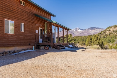 View of side of home featuring a mountain view
