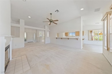Unfurnished living room featuring light colored ca