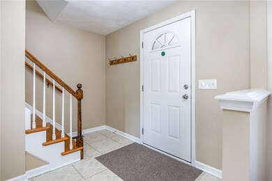 Front foyer with hooks and coat closet