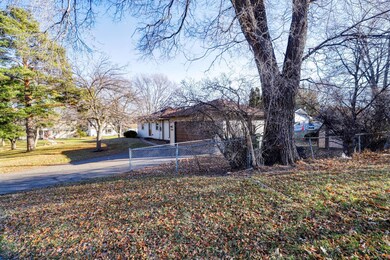 Side view of driveway, and 2 stall garage