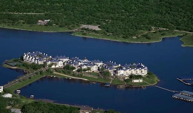 Aerial view of property and surrounding area with