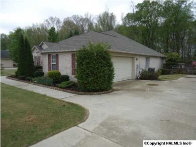 Side view with concrete driveway