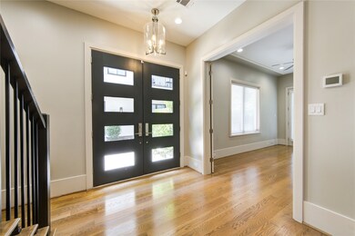 This entryway features a modern double door with g