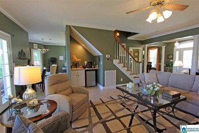 Features a coffee or wine bar and French doors tha