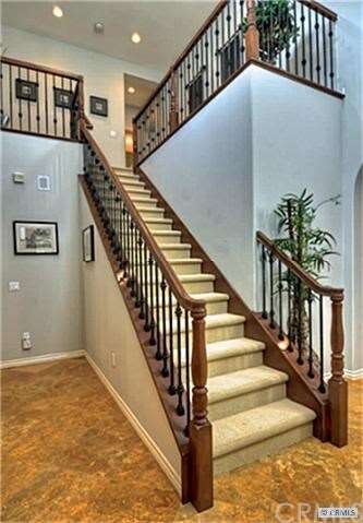 Stairs to upper level. View is from the right of the entrance