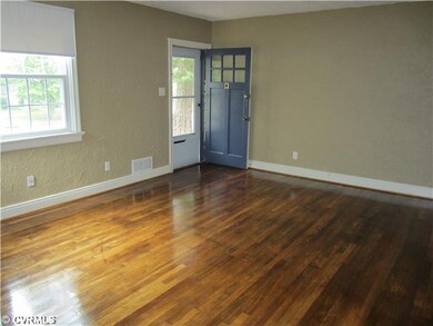 Living Room - Looking at the front door and living room from the dining room door.