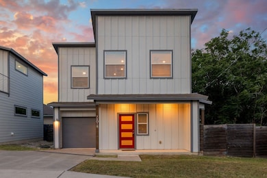 Contemporary home featuring board and batten sidi