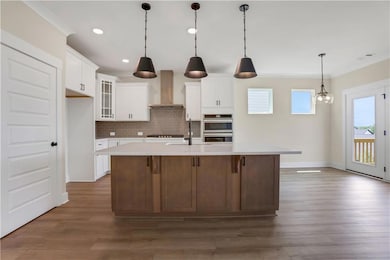 Photos are of a similar home