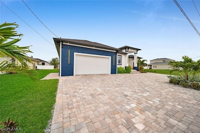 Prairie-style home with an attached garage, a fron