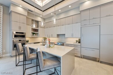 Kitchen with a towering ceiling, paneled built in