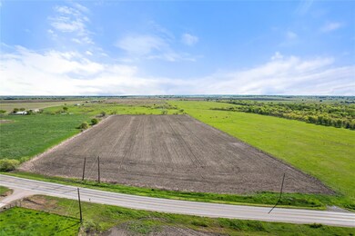 Birds eye view of property with a rural view