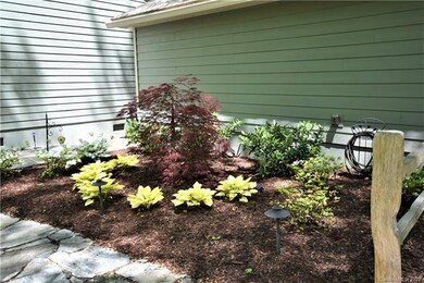Landscaped area beside the garage