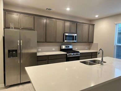 Kitchen featuring appliances with stainless steel