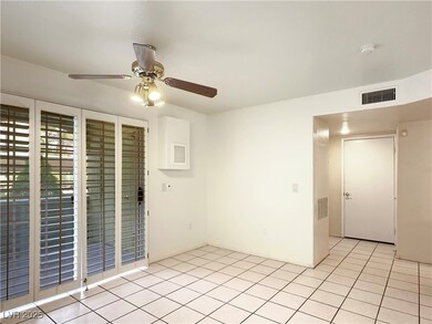 Empty room featuring light tile patterned flooring