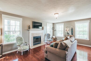 Wood burning fireplace with beautiful mantle, tile work and hearth!