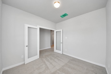 An aerial view of a spacious subdivision lot, high