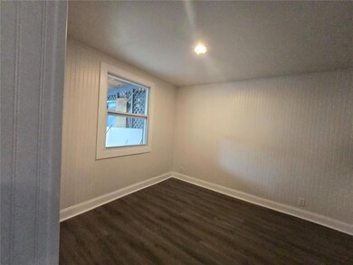 Spare room featuring dark hardwood / wood-style flooring