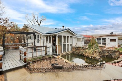 Back of house with patio and koi pond