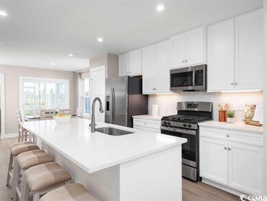 Kitchen featuring stainless steel appliances, ligh