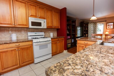 Kitchen with granite and maple cabinets
