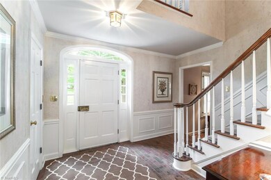 Brick floor is a special Custom feature of this spacious entrance.