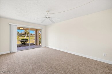 Livingroom has new carpet and a sliding door leadi