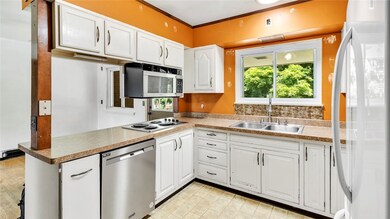 The Kitchen has a through opening to the dining ar