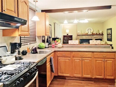 Kitchen with breakfast bar, open to family room
