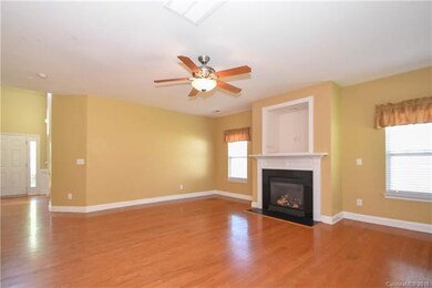 Huge great room with gas fireplace is open to kitc