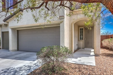 Property entrance with stucco siding, driveway, an