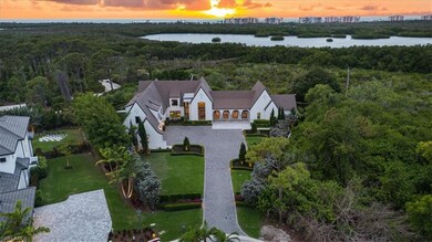Aerial view at dusk with a water view and a view o