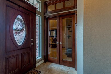 Pretty French doors lead to the study/office area 