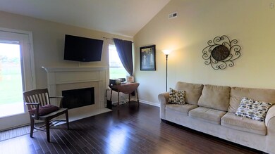 Spacious living room with fireplace! Hardwood floors! Vaulted ceiling! Look at the walkable floorplan here: http://bit.ly/24YFvnU