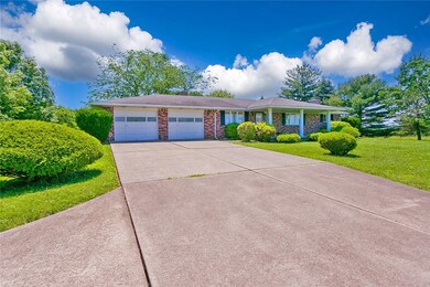 Long concrete driveway allows for ample parking &