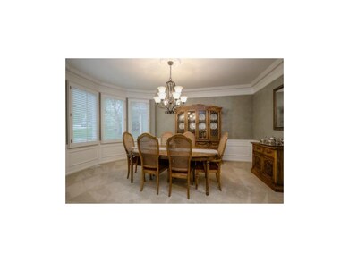 DINING ROOM WITH EXQUISITE MOLDING AND WOOD TRIM