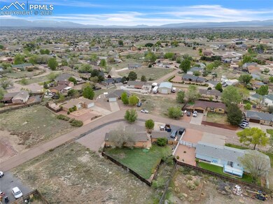 Aerial view of residential area featuring mountain