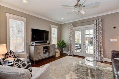 Great room has french doors opening to covered por