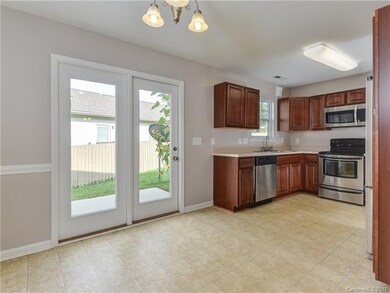 Kitchen/Dining space with door to back patio