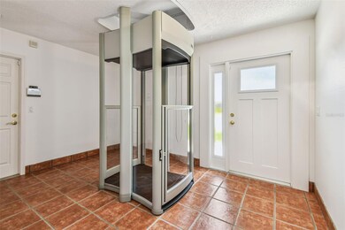 Ground Level Entry Foyer with Elevator and Garage Access