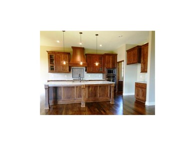 Stunning kitchen has large island, built in oven &