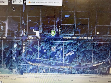 Aerial view of corner lot on northwest corner of Juniper Trail and 5th Streets.  Leland Township maintains beach access at the end of 4th street and Hywood.