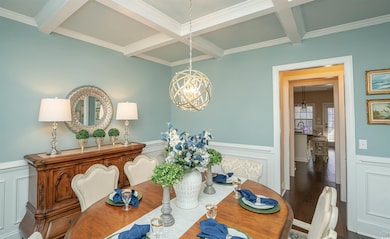 Dining area featuring an inviting chandelier, coff