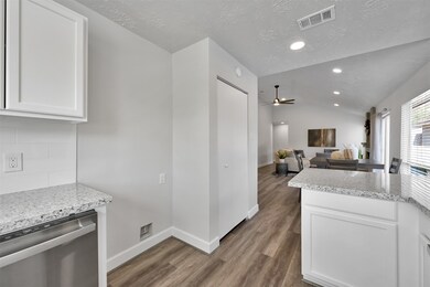 The pantry was updated with new shelving and a bi-fold door.  Plenty of storage and room for the trash can to be tucked away.
