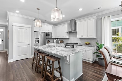 Kitchen featuring high end appliances, white cabin