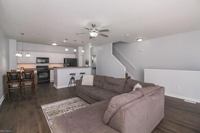 Great room opens to the dining and open kitchen area.