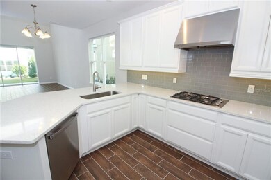 This beautiful kitchen opens right up to the family room so the chef won't miss out on a thing!