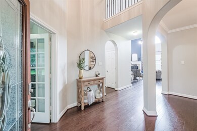 Gleaming hardwoods greet you as you entry this two story foyer