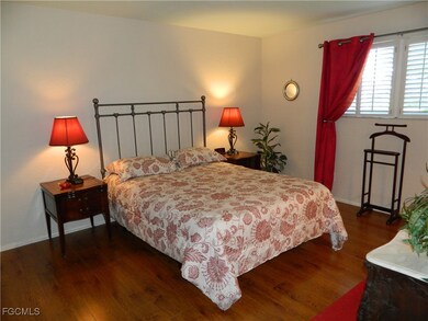 Bedroom featuring dark wood-style flooring